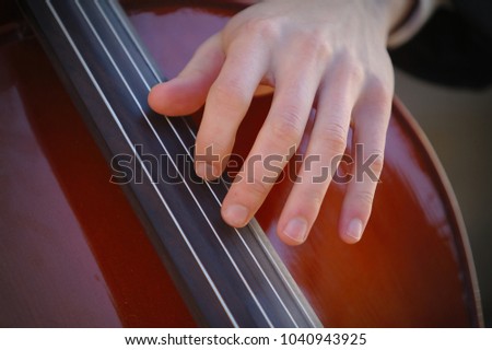 Hand on cello string