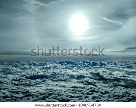 sun ring behind thin clouds