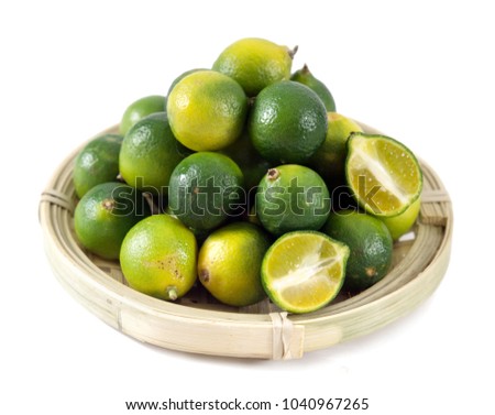 Cumquat or kumquat with half isolated on white background close up