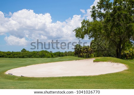 Large sand trap on beautiful Florida golf course
