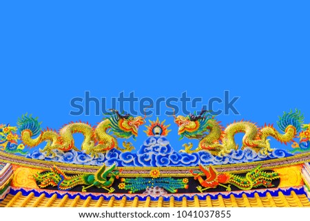 Double Dragon Statue on blue background