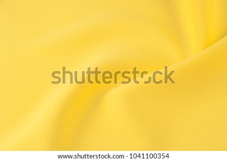 heavy silk Yellow fabric. 100% silk fabric is thick, but elastic and has a natural woven texture of the surface that will be combined with any pattern or motif that you might want to combine it with