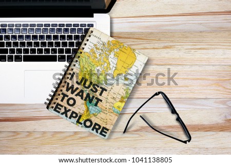 Creative flat lay photo of workspace desk with coffee cup and laptop, eyeglasses, notebook on wooden background texture, of free space your copy, view from top.Office desk top.