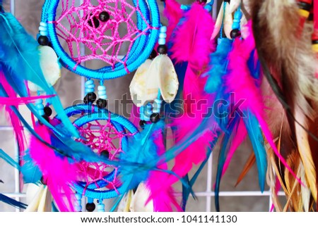 Close up blue and ultra violet dream catcher hanging at shop, symbolic of luck, colorful of beauty and fashion inspiration concept