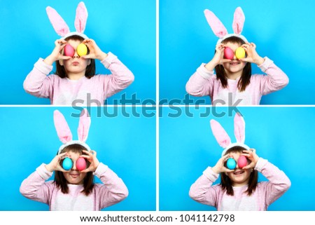 Little girl in a rabbit costume with Easter eggs on a blue background.
