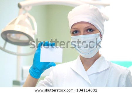 Female doctor keeps a card in his hand