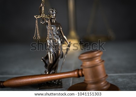 Law and Justice concept. Gray stone background, reflections on the floor, place for typography. Courtroom theme.