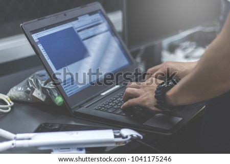 Administrator working in data center configure and check internet network on computer laptop ,Hands typing text on a laptop keyboard , Selective focus  - computer network concept Royalty-Free Stock Photo #1041175246