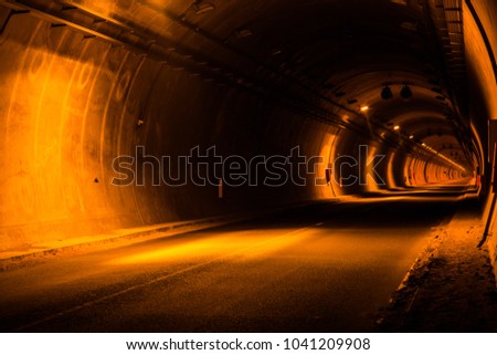 road tunnel, night illuminated Royalty-Free Stock Photo #1041209908