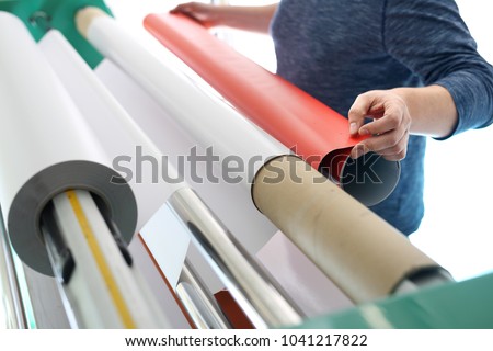 Printing on self-adhesive foil
The printer supports a printing plotter. Royalty-Free Stock Photo #1041217822