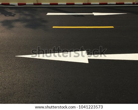 asphalt road with arrow and line texture