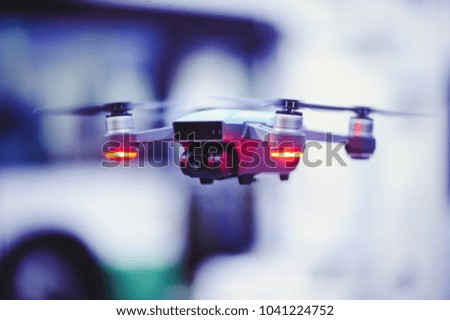 drone in flight in the city of a close-up, a quadrocopter on the background of a beautiful bokeh.