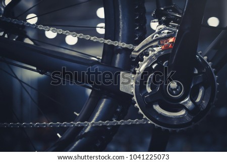 Closeup of a mechanism of bicycle mechanisms and chain on a mountain bike. Pedals from a mountain bike. Close the detailed view. Royalty-Free Stock Photo #1041225073