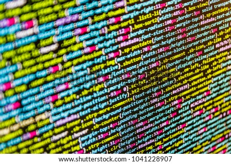 Source code close-up. Software abstract background. PC software creation business. Website HTML Code on the Laptop Display Closeup Photo. Digital technology on display. 