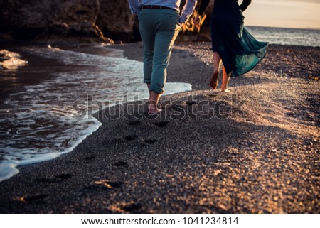 Young couple is  walking in Costa del Sol , Malaga, Spain Royalty-Free Stock Photo #1041234814