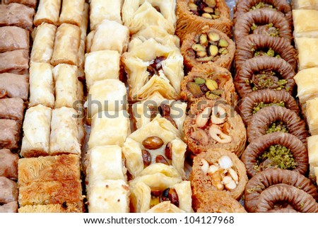 Turkish and Arab dessert food, Arabian sweets background. Top view of assorted Lebanese and Egyptian pastry set. Middle East food in bakery, traditional oriental eating. Delight and Ramadan theme.