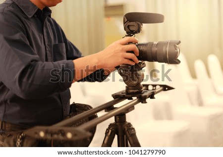 Man Video camera operator working with his equipment