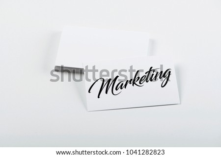Business card concept with the word Marketing. Isolated. Mockup.