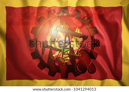 Oil rig on the background of the flag of Montenegro. Mixed environment. The concept of oil production, minerals, development of new deposits, well.