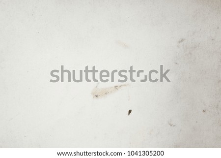 Blank aged paper sheet as old dirty frame background with dust and stains. Front view. Vintage and antique art concept. Detailed closeup studio shot.