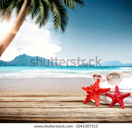 Summer desk of free space for your deoration and blurred background of beach. 