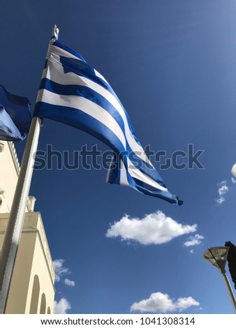Photo of Greek flag waving in strong wind