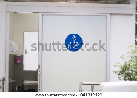 Entrance door to the Public toilet for disabled people, pregnant women, old people, Toilet sign on door