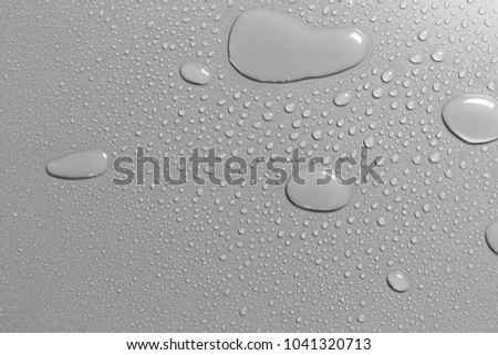 Surface with water drops, grey background