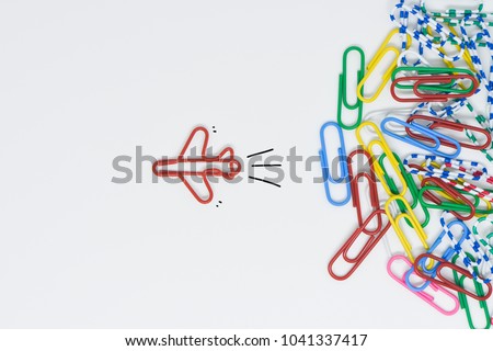 Business concept for group of stacked paperclip with another one red plane paperclip is point to another direction as a team leadership Royalty-Free Stock Photo #1041337417