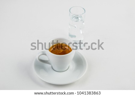 Espresso in a white cup with water