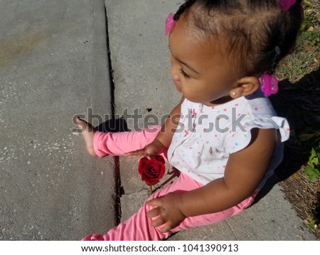 Pic of toddler with Rose out of Concrete