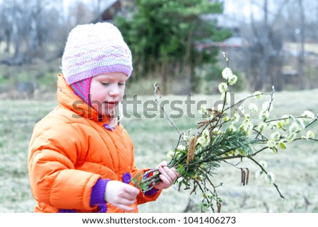 Adorable little girl walking in a spring park