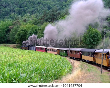 The small steam train connect the village of Tournon and Lamastre in the French Ardéche region. The mountainous path winds along a length of 30 km, is a very appreciated tourist railway Royalty-Free Stock Photo #1041437704