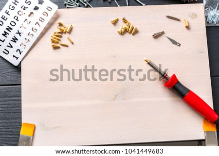 Stock picture of pyrography pen , tools and creative hobby work