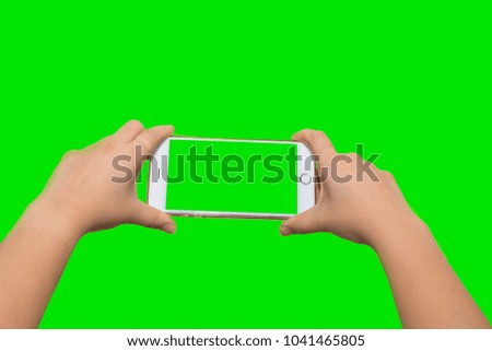 Woman Hand hold Touch Screen Smartphone Isolated on Green Background.