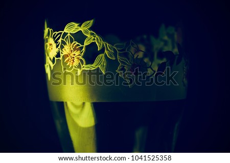 Stylish wine glass isolated object with yellowish light effects photograph