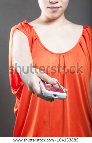 Young women with a remote control