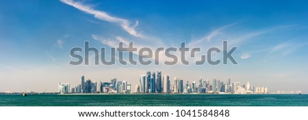 Panoramic view of Doha Qatar skyline on sunny day Royalty-Free Stock Photo #1041584848