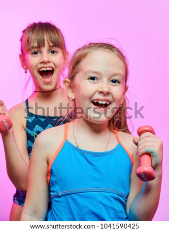 little funny girls in swimwear with dumbbells