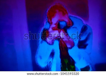Thermographic image of the photographer. Photo showing different temperatures in range of colors, blue showing cold, red showing hot which can indicate joint inflammation
