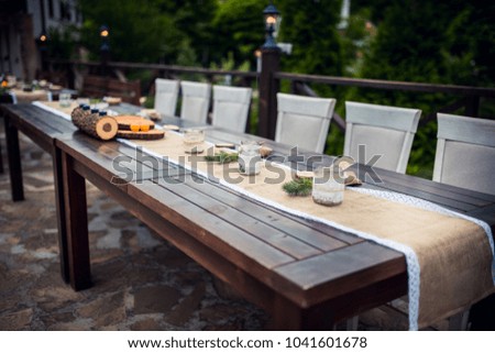 Wedding. Banquet. The chairs and table for guests, decorated Royalty-Free Stock Photo #1041601678