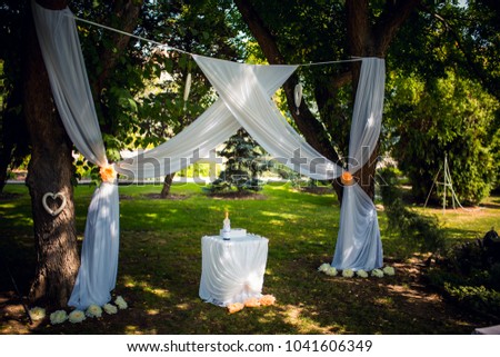 Wedding Ceremony with flowers outside in the garden Royalty-Free Stock Photo #1041606349