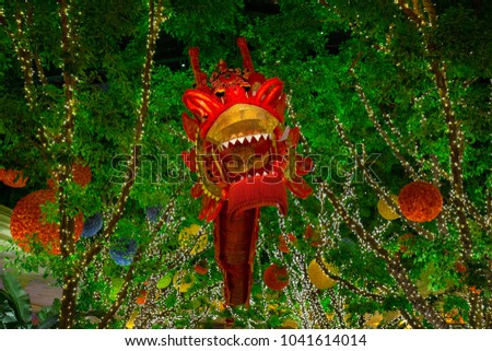 Chinese red dragon on the background of flowers. Las Vegas. Nevada. USA. 