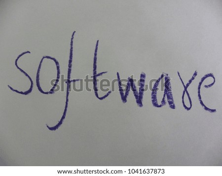 Text software hand written by blue oil pastel on white color paper
