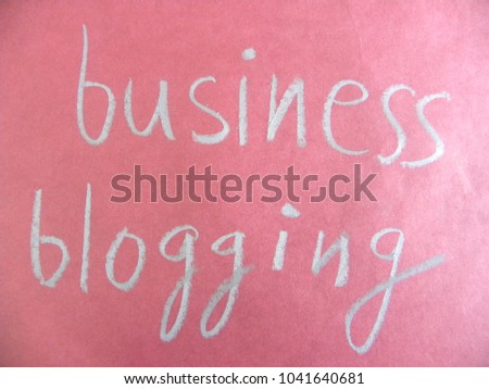Text business blogging hand written by silver oil pastel on red color paper