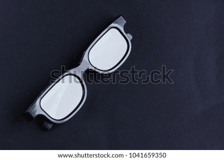 black 3d glasses on black background with copy space for text