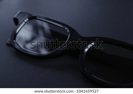 black 3d glasses on black background with copy space for text
