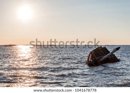 An old shipwreck on beach. / Shipwreck in Ang Sila, Chonburi, Thailand.