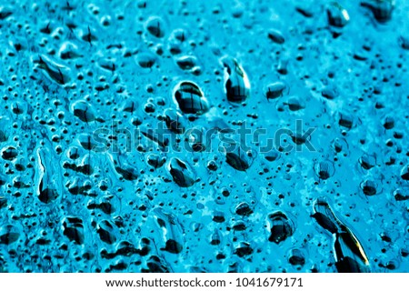 Drops of water on glass abstract background.