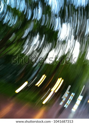 Abstract background of trees, grasses and light lines.